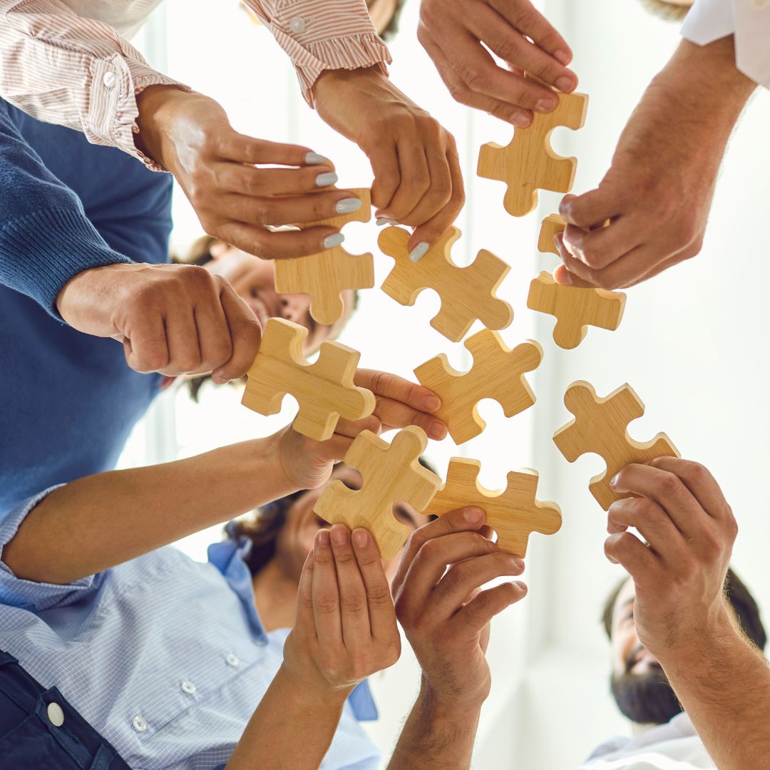 employees holding puzzle pieces