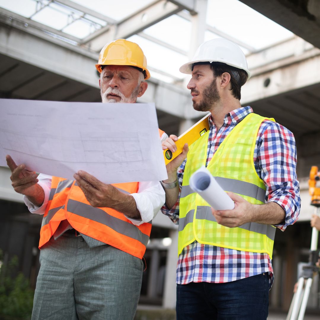 Two construction workers going over plans